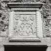 Detail of armorial panel and date lintel (1730) above doorway on south face of barn