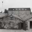 View from NE of new Still House, with cooperage in foreground