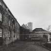 View from E along NE side of former Maltings block, at S end of distillery