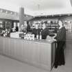 Interior. Visitor Centre, view from S in new shop area, with staff