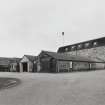 View from N of N end of distillery, showing Cooperage (foreground), and new Still House (right)