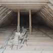 View from North East in roof space showing grain conveyor, from threshing machine