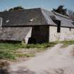 View from West showing water wheel house (with single pitch roof) and barn