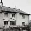 View from W showing Victorian house to N and 1930's house to S