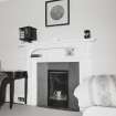 Interior. Detail of fireplace in rear bedroom in Victorian wing