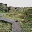 General view from NE of northern gun-emplacement engine room and the concrete trackway between buildings.