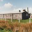 Tain Airfield, No.4 dispersal area.  Accomodation huts of wooden construction, probably pre-war, now in use as temporary hutting.  Part of original pre-war Bombing Range, view from SE.