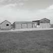 Tain Airfield, No.4 dispersal area.  Garage and transport buildings re-used from original Bombing Range, view from S.
