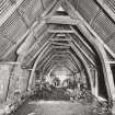 Fernaig cruck-framed barn, interior.
General view of beam structure from South.
