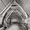 Fernaig cruck-framed barn, interior.
General view of beam structure from North.