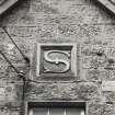 Detail of 'Sutherland' plaque on S gable of W end block of steading