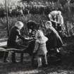 In the grounds of Addistoun House, 'Tattie lifting', children in garden.  
Copied from Album no.145