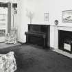 Interior. View of first floor drawing room from East showing white marble fireplace and bay window
