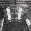Gasworks, interior.
View of roof construction and pulley-beams of bay-fronted gasometer house.
