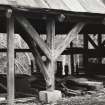 Secondary timber store; view of typical upright, with splayed braces shouldered into the centre post