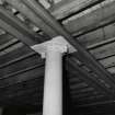 Whisky Bond, interior.
Detail of adjusted cast-iron column, steel beams and wooden floor, ground floor, North half of no.3 warehouse.