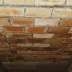 Whisky Bond, interior.
Detail of fireclay tiles between concrete beams, warehouse no.2, basement.