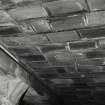 Whisky Bond, interior.
Detail of fireclay tiles between concrete beams, warehouse no.2, basement.
