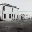 Whisky Bond.
General view of house and offices and main gate from central courtyard from South West.