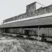 Whisky Bond.
General view of lean-to and rear of warehouse from North West.