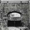 Detailed view of the arched entrance to the Boroughloch Brewery looking onto Boroughloch Lane seen from Boroughloch Square from the South East.