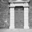 Detail of pedimented main entrance.