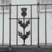 Detail of thistle ironwork on Queensberry House perimeter wall