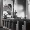 Interior view of Canongate Church, showing wall across apse, and pulpit.