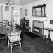 Interior, view of dining room from North East showing fireplace