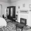 Interior, view of first floor South West bedroom from North East showing fireplace