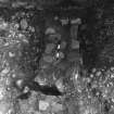 Excavation photograph : area 1 and 2, f10 - basal layers of wall.