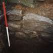 Excavation photograph : stone lining of pit?