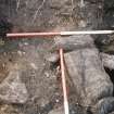 Excavation photograph : stone lining of pit?