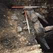 Excavation photograph : view of stone lined pit.