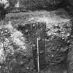 Excavation photograph: section of post-hole in S range of S wing of fabrica