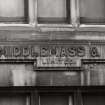 Detailed view of the inscription on the Salisbury Place facade: 'R Middlemass & Son. Limited. 1895' seen from the North North West.