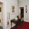 View of second floor hall, showing speaking tube and collection paddle