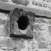 Detail of damaged spout - one of two stone spouts protruding from block 4 in range at first floor level on main (South West) frontage, repeated on North East frontage.