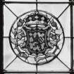 Detail of circular stained glass panel in South wall depicting lion rampant.