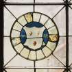 Detail of circular stained glass panel in South wall depicting the coat of arms of Mitchell Macquhane.