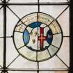 Detail of circular stained glass panel in South wall depicting the coat of arms of Janet Rynd.