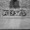 Detail of 1932 date plaque over main entrance.