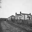 General view of farmhouse and steading from SSW.