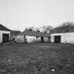 General view across yard from SW.