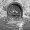 Detail of firebox with semicircular iron lintel/surround and masonry sill