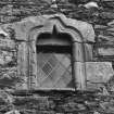 Second floor window wth  quirked roll and scallop mouldings on quoins, NW wall of stair turret