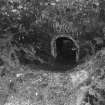 Detail inside shaft of kiln at W end of range, showing inside of draw-hole.

