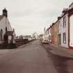 View Main Street and Isle Parish Church from SE.