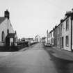 View Main Street and Isle Parish Church from SE.