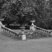View of steps edged by balustrades surmounted by decorative urns